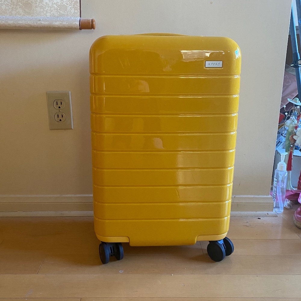 ISO- Away yellow or saffron suitcase